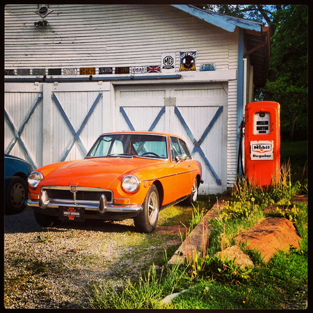 Orange MG Hatchback & Gas Pump